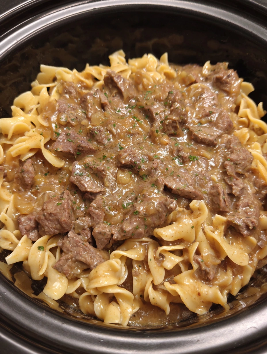 Tender shredded beef and thick homestyle egg noodles combined in rich slow-cooker gravy