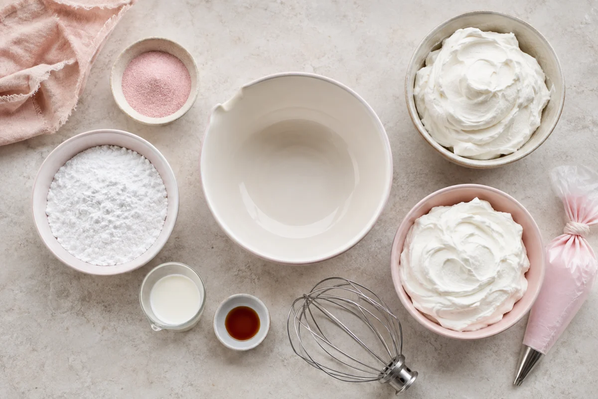 Strawberry gelatin powder, powdered sugar, milk, vanilla, and two bowls of thawed whipped topping